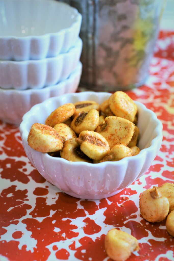 up close image of crunchy party food in mini white bowl 