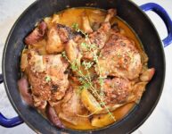 Braised Chicken with Cinnamon & Hard Apple Cider just roasted in cobalt blue round roasting pan