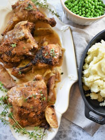 overhead image of Braised Chicken with Cinnamon & Hard Apple Cider mashed potatoes and peas