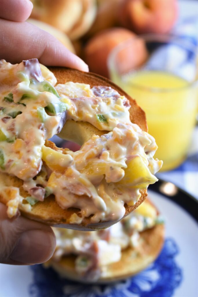 up close image of toasted bagel slice with cream cheese schmear