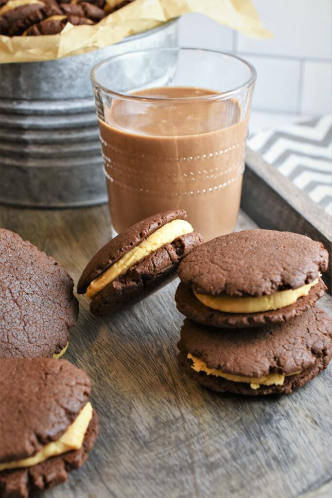 up close image of one glass of chocolate milk with cookies