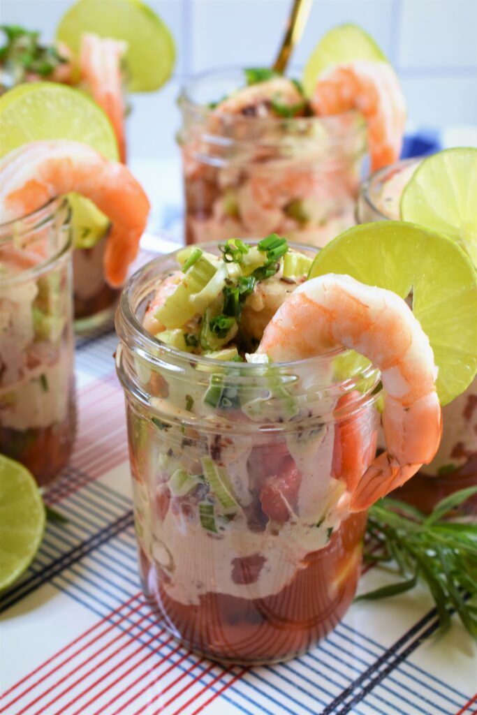 mason jars of salad ready for a picnic