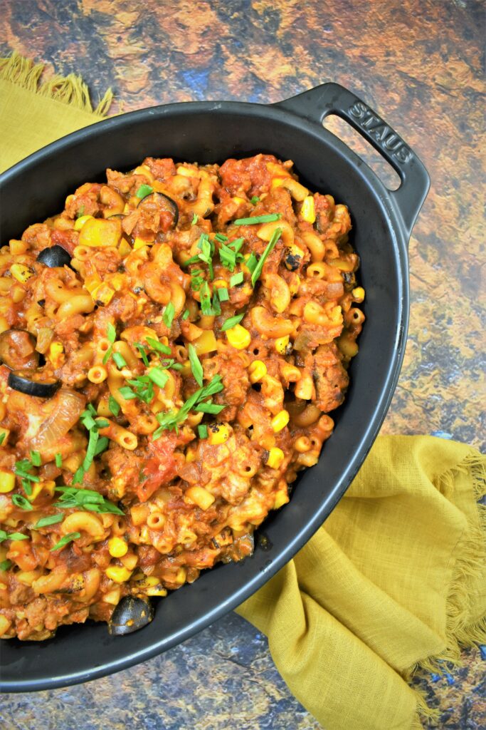 vegan chorizo Mexican goulash in black casserole staub dish