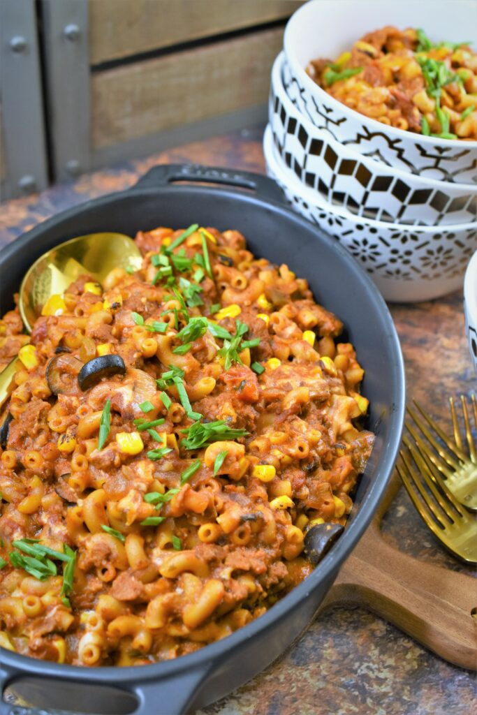 vegan chorizo Mexican goulash in black casserole staub dish