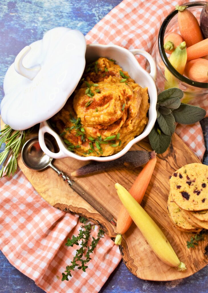 fall appetizer dip in white bowl on cutting board