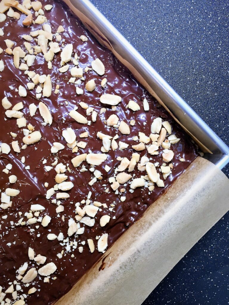 vegan peanut butter and dark chocolate rice crispy treats cooling in pan