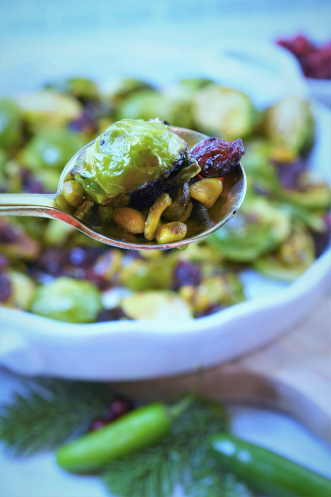 up close gold spoon with veggies
